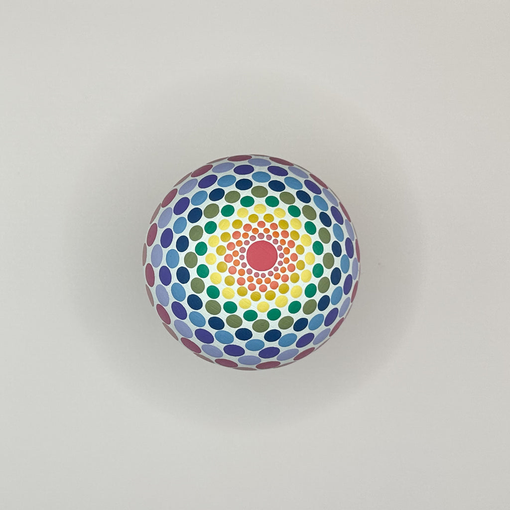 Colorful circular pattern with concentric circles on a gray background