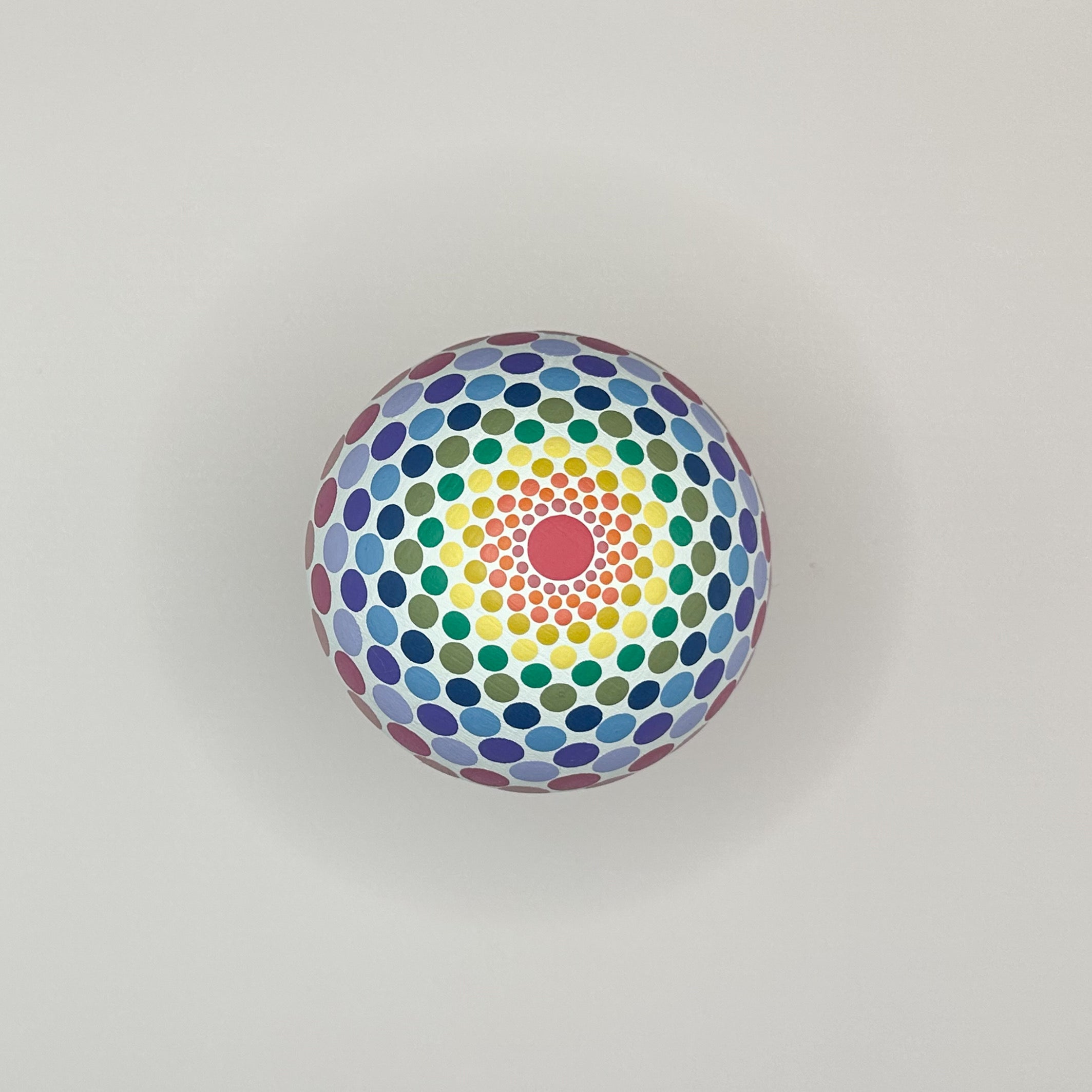 Colorful circular pattern with concentric circles on a gray background