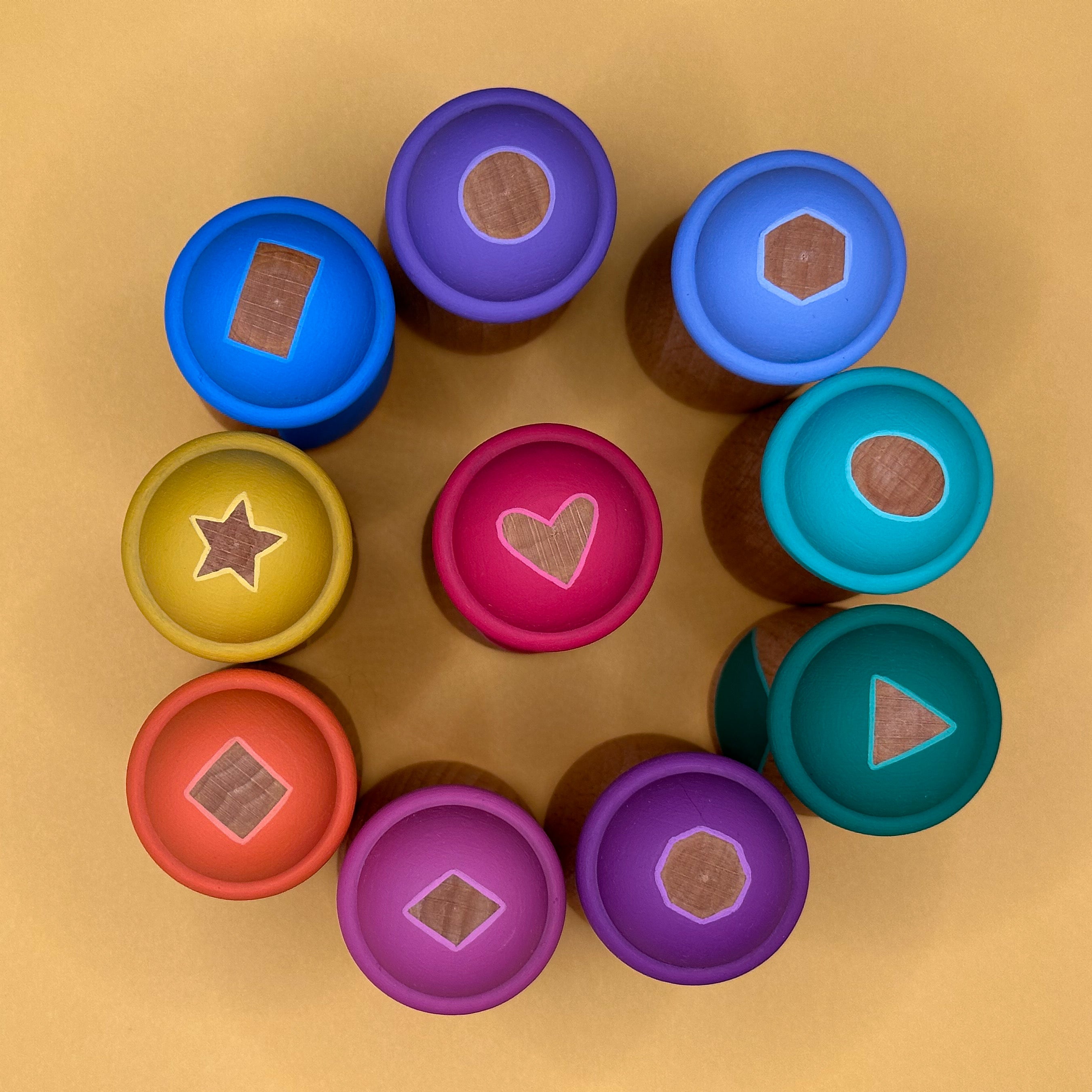 Colorful doll hats with different shapes on a gold background