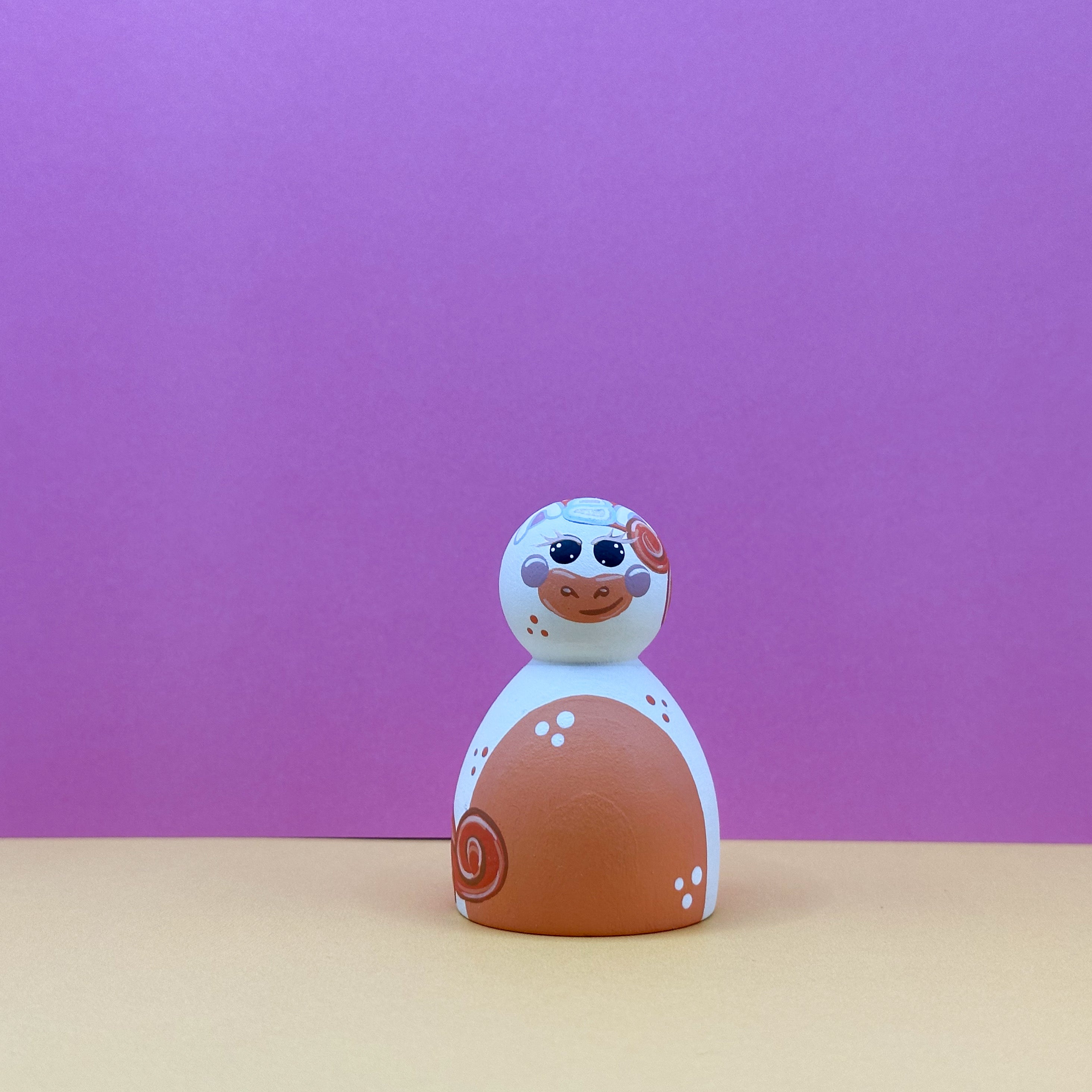 Toy figure with a purple background