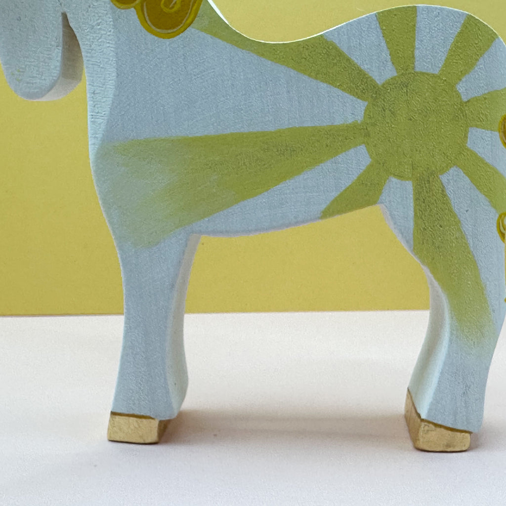 Wooden horse figurine on a white background
