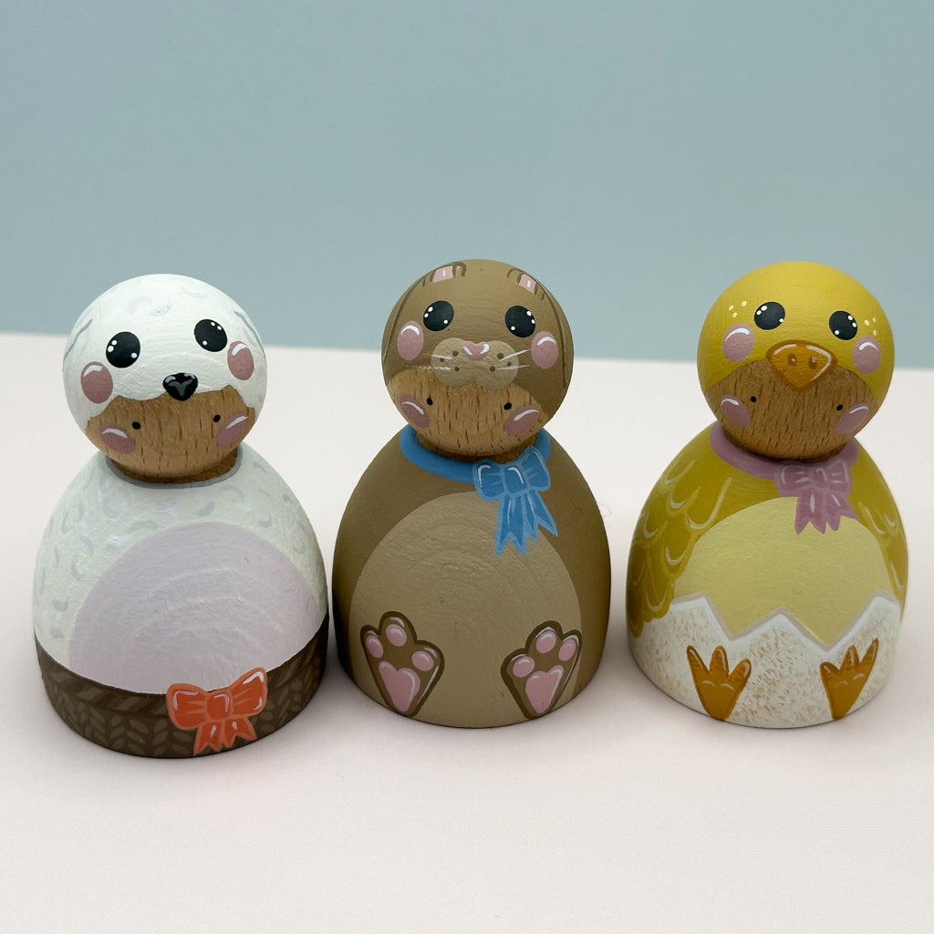 Three animal-themed decorative items on a white surface with a light blue background