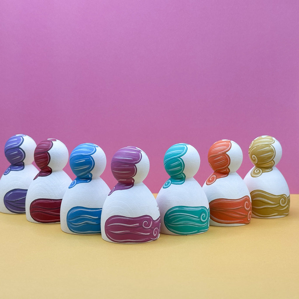 Colorful objects on a pink and yellow background