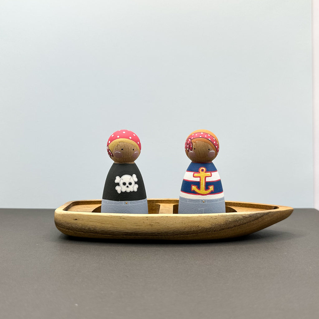Pirate themed peg doll toys with a wooden boat