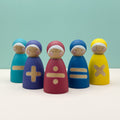 Colorful wooden figures with mathematical symbols on a light blue background