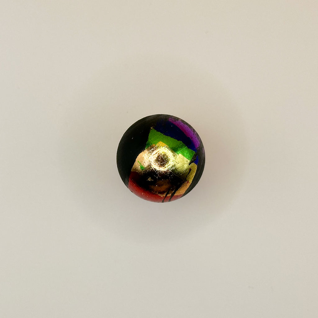 Multicolored toy on a light gray background