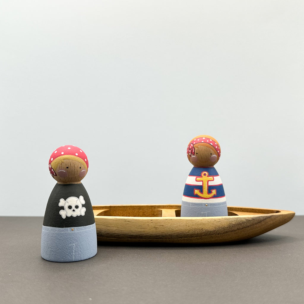 Pirate themed peg doll toys with a wooden boat