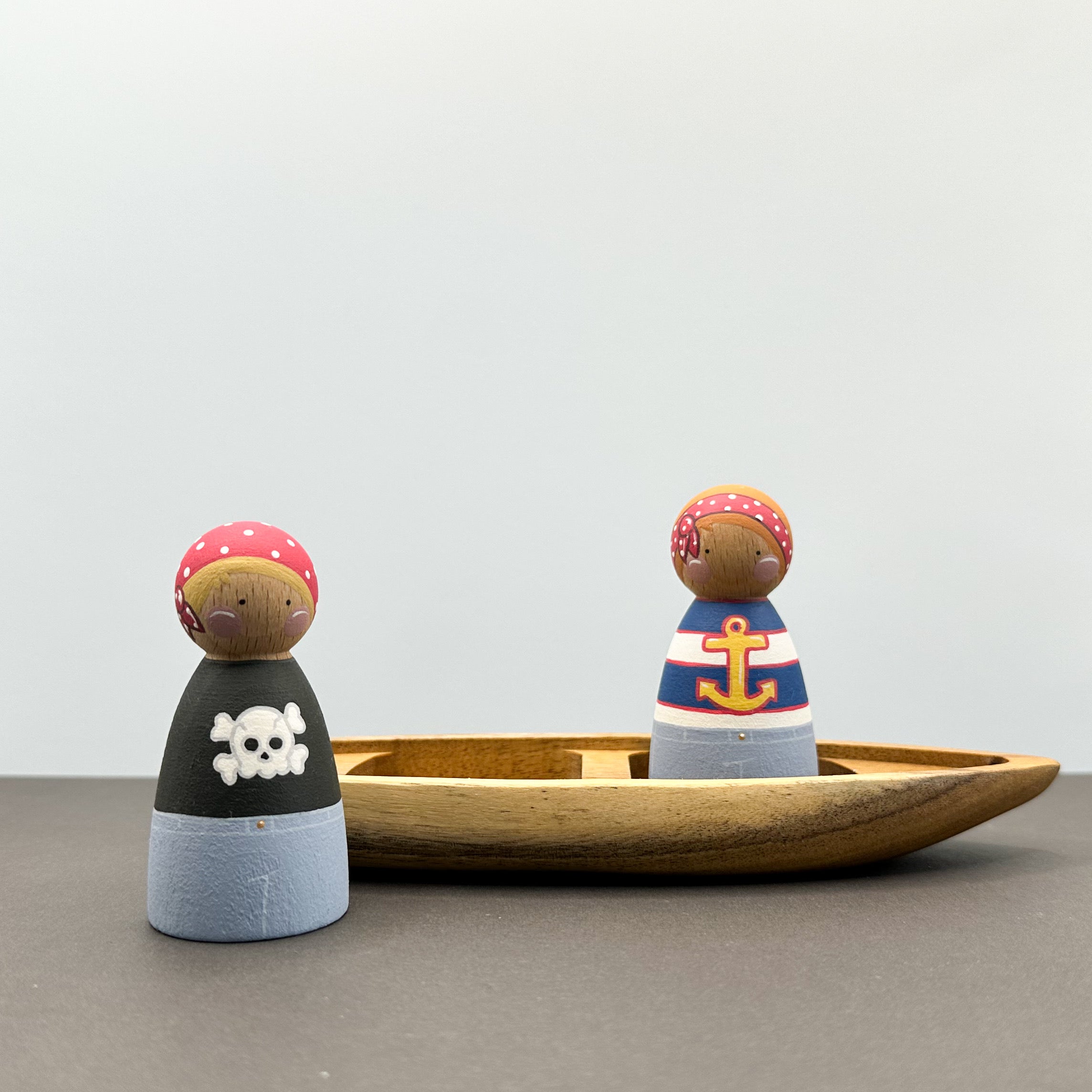 Pirate themed peg doll toys with a wooden boat