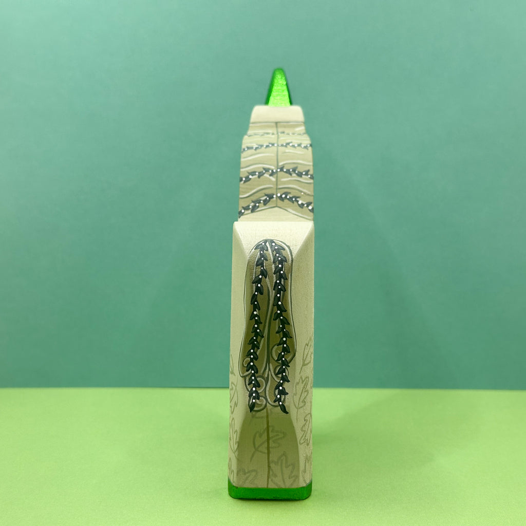 Decorative unicorn with a green tail and base on a green background