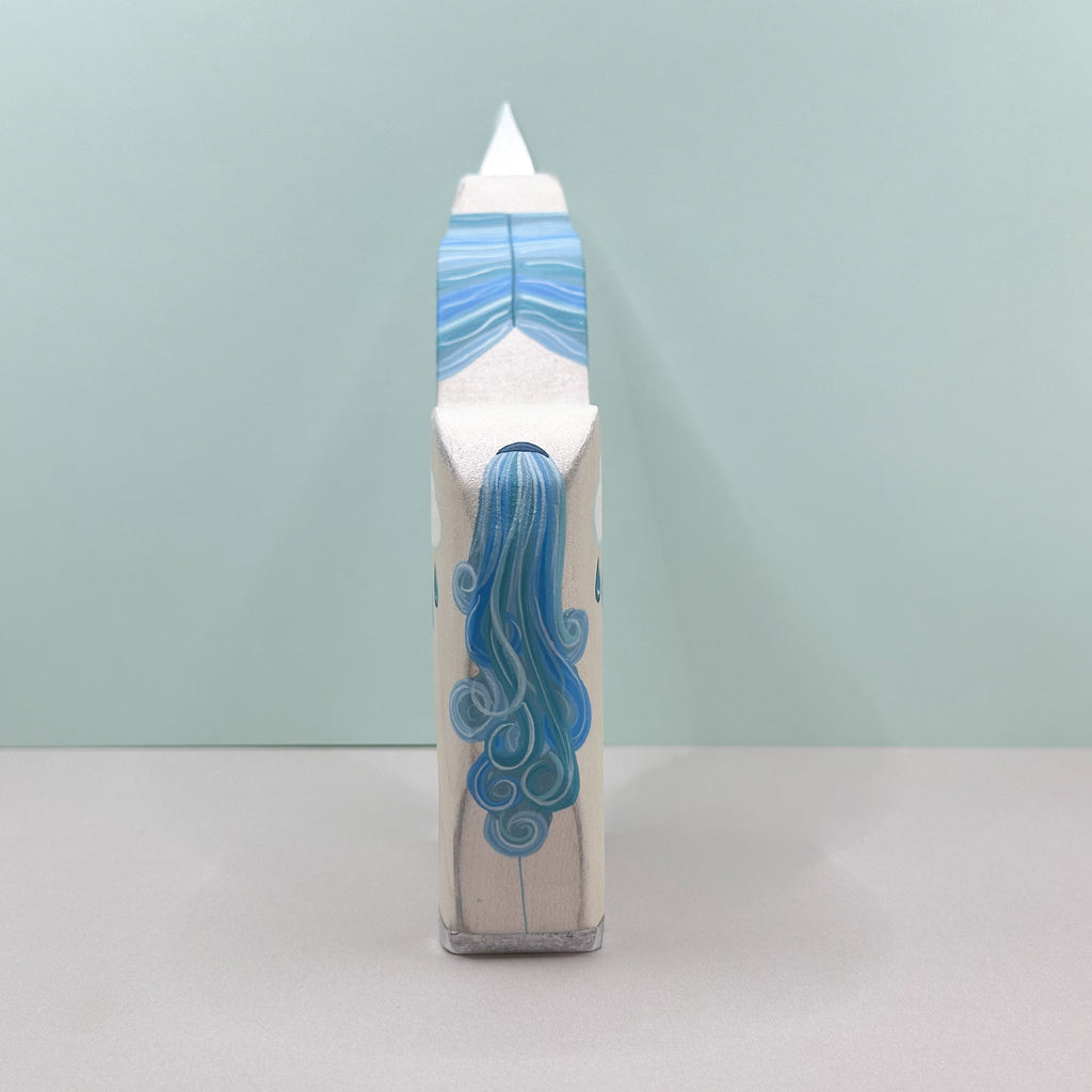 Cylindrical product with blue design on a light gray background